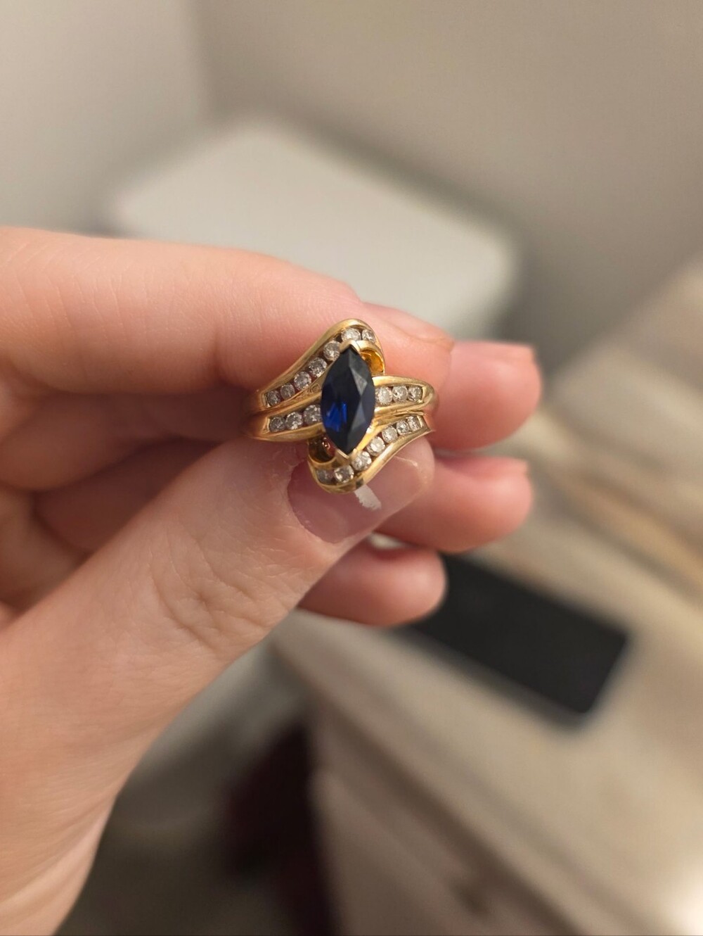 Gold Ring with Blue Marquise Sapphire and Diamond Accents